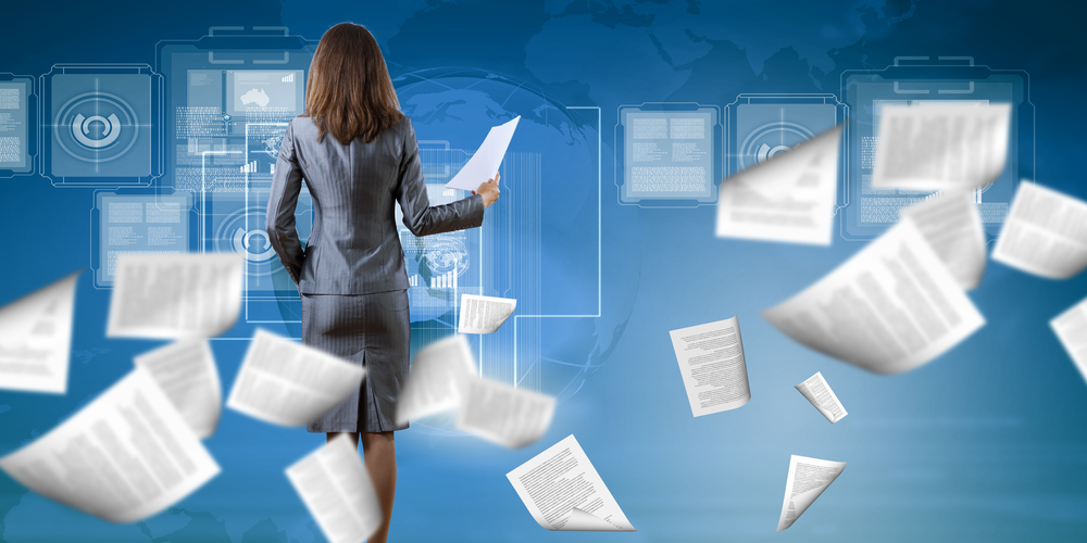 Business woman in a sea of paperwork