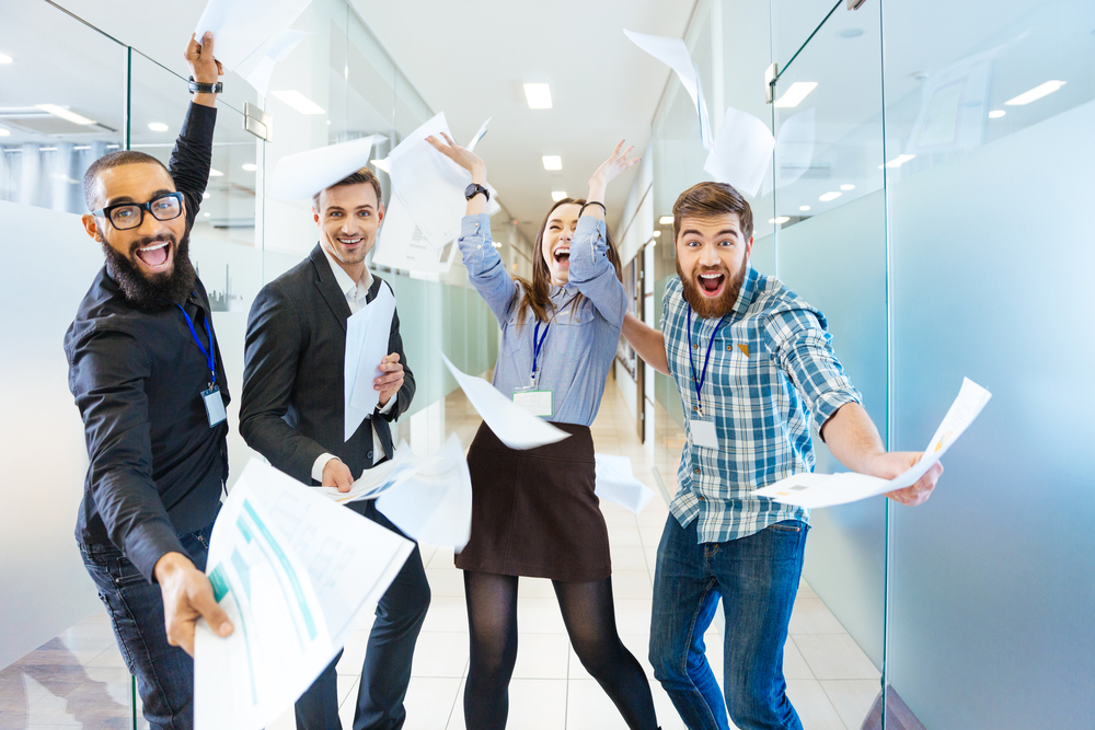 image depicting excited coworkers